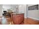 Kitchen island with granite countertop and space for seating, open to living and dining areas, perfect for entertaining at 3230 Sundew Nw Dr, Acworth, GA 30101