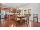 Eat-in kitchen with stainless steel appliances, granite counters, and a view of the patio through french doors at 3230 Sundew Nw Dr, Acworth, GA 30101
