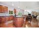 Open kitchen with island, granite countertops, modern appliances, and seamlessly connects to the living and dining area at 3230 Sundew Nw Dr, Acworth, GA 30101