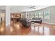 Open-concept living room features hardwood floors, ample natural light, and is seamlessly connected to the kitchen at 3230 Sundew Nw Dr, Acworth, GA 30101