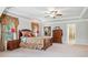 Spacious main bedroom featuring a trey ceiling, large windows, hardwood furniture, and ensuite bathroom at 3230 Sundew Nw Dr, Acworth, GA 30101