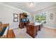 Cozy office featuring a large desk, carpet, and a bright window with a backyard view at 3230 Sundew Nw Dr, Acworth, GA 30101