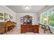 Spacious home office featuring a large desk, piano, and plenty of natural light from the oversized window at 3230 Sundew Nw Dr, Acworth, GA 30101