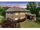 The rear exterior of this lovely home includes a cozy covered patio and fireplace at 3230 Sundew Nw Dr, Acworth, GA 30101