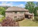 Brick home's rear exterior with a covered patio overlooking a landscaped yard at 3230 Sundew Nw Dr, Acworth, GA 30101
