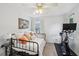 Cozy bedroom featuring a daybed with decorative pillows, a stationary bike, and soft natural lighting, perfect for relaxing at 267 Somerlane Pl, Avondale Estates, GA 30002