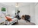 Versatile bedroom with a daybed, desk, and exercise bike, offering a flexible space for work and fitness at 267 Somerlane Pl, Avondale Estates, GA 30002