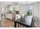 Inviting dining area featuring hardwood floors, modern decor, and natural light from the window at 267 Somerlane Pl, Avondale Estates, GA 30002