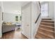 Inviting entryway showcasing hardwood floors and a carpeted staircase leading to the upper level at 267 Somerlane Pl, Avondale Estates, GA 30002
