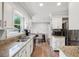 Well-lit kitchen featuring stainless steel appliances, granite countertops, and white cabinetry at 267 Somerlane Pl, Avondale Estates, GA 30002