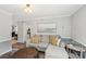 Comfortable living room with neutral tones and an inviting sectional sofa with yellow pillows at 267 Somerlane Pl, Avondale Estates, GA 30002