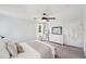 Light-filled main bedroom featuring a ceiling fan, soft decor, and ample storage space at 267 Somerlane Pl, Avondale Estates, GA 30002