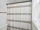 Close-up of the bathroom shower with a stylish striped curtain and natural light at 267 Somerlane Pl, Avondale Estates, GA 30002