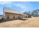 Expansive backyard featuring a covered patio and well-maintained lawn at 3415 Linstead Ct, Loganville, GA 30052