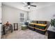 Neutral bedroom with boxes, ceiling fan, and natural light through the window at 3415 Linstead Ct, Loganville, GA 30052