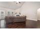 Bright living room with high ceilings, hardwood floors, neutral walls, and a cozy fireplace at 3415 Linstead Ct, Loganville, GA 30052