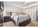 Large main bedroom with tray ceiling, ceiling fan and lots of natural light at 3415 Linstead Ct, Loganville, GA 30052
