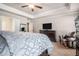 Bright main bedroom with neutral walls, tray ceiling, ceiling fan, and lots of natural light at 3415 Linstead Ct, Loganville, GA 30052