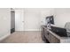 Bright home office space with a large desk and neutral carpeting throughout at 3415 Linstead Ct, Loganville, GA 30052