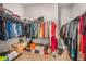 Well-organized walk-in closet with shelving and hanging rods on both sides at 3415 Linstead Ct, Loganville, GA 30052