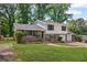 Charming two-story home with a brick and siding exterior, large front lawn, and two car garage at 6997 Vesta Brook Dr, Morrow, GA 30260