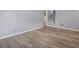 Hardwood floors, gray walls, stairs to the second floor, and nice lighting in living room area at 6997 Vesta Brook Dr, Morrow, GA 30260