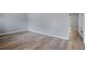 A spacious living room featuring gray walls and new hardwood flooring with natural lighting at 6997 Vesta Brook Dr, Morrow, GA 30260