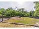 Large backyard featuring a wooden gazebo and mature trees at 1584 Water Springs Way, Dacula, GA 30019