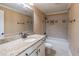 Neutral bathroom with granite counters, large mirror, and tiled shower/tub combo at 1584 Water Springs Way, Dacula, GA 30019