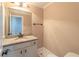 Charming powder room with granite countertops, framed mirror, and neutral wall paint at 1584 Water Springs Way, Dacula, GA 30019