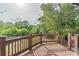 Spacious wooden deck overlooking lush green landscaping and mature trees at 1584 Water Springs Way, Dacula, GA 30019