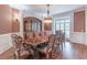 Elegant dining room displaying hardwood floors, ornate furniture, and natural light at 1584 Water Springs Way, Dacula, GA 30019