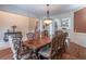 Spacious dining room area featuring hardwood floors, a chandelier, and an open layout at 1584 Water Springs Way, Dacula, GA 30019