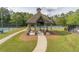 Community gazebo with picnic tables next to tennis courts and a walking path at 1584 Water Springs Way, Dacula, GA 30019