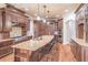 Gourmet kitchen boasts custom cabinetry, granite island, and stainless steel appliances at 1584 Water Springs Way, Dacula, GA 30019
