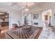 Inviting living room featuring a fireplace, elegant decor, and an open layout at 1584 Water Springs Way, Dacula, GA 30019
