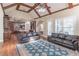 Bright and airy living room with a vaulted ceiling, hardwood floors, and large windows at 1584 Water Springs Way, Dacula, GA 30019