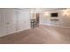 Carpeted living room features a bar and ample closet space at 1584 Water Springs Way, Dacula, GA 30019
