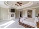 Expansive main bedroom with fireplace, ample natural light, and access to ensuite bathroom at 1584 Water Springs Way, Dacula, GA 30019