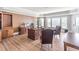 Large office with hardwood floors, built-in shelving, and abundant natural light at 1584 Water Springs Way, Dacula, GA 30019