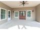 Covered patio with neutral paint, ceiling fan, and double doors at 1584 Water Springs Way, Dacula, GA 30019