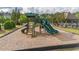 Community playground with slides and climbing equipment near the tennis court and gazebo at 1584 Water Springs Way, Dacula, GA 30019