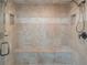 Modern tile shower with built-in bench, dual shower heads and recessed shelving at 1584 Water Springs Way, Dacula, GA 30019