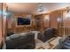 Entertainment room features plush reclining chairs, custom millwork, sconce lighting and projector screen at 1584 Water Springs Way, Dacula, GA 30019