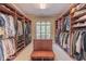 Spacious walk-in closet with custom shelving and center island for organization at 1584 Water Springs Way, Dacula, GA 30019