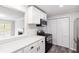Bright, updated kitchen featuring white cabinets and stainless steel appliances at 204 Countryside Se Pl # 204, Smyrna, GA 30080