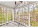 Bright sunroom with plenty of natural light, views of trees, vinyl floors and ceiling fan at 204 Countryside Se Pl # 204, Smyrna, GA 30080