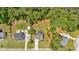 Aerial view of homes with large, fenced backyards, mature trees, and well-maintained lawns at 40 Polo Xing, Hiram, GA 30141