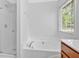 Bathroom featuring garden tub, walk-in shower with glass, and window with blinds providing natural light at 40 Polo Xing, Hiram, GA 30141