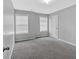 Bedroom with neutral carpet, white trim, and natural light from two windows with blinds at 40 Polo Xing, Hiram, GA 30141